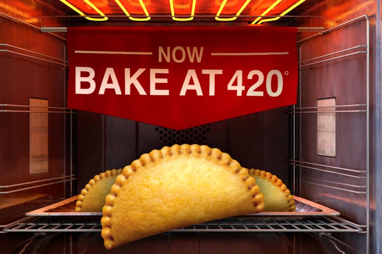 Three Pizza Pop's on a tray in the oven with "Now Bake at 420" in the background.